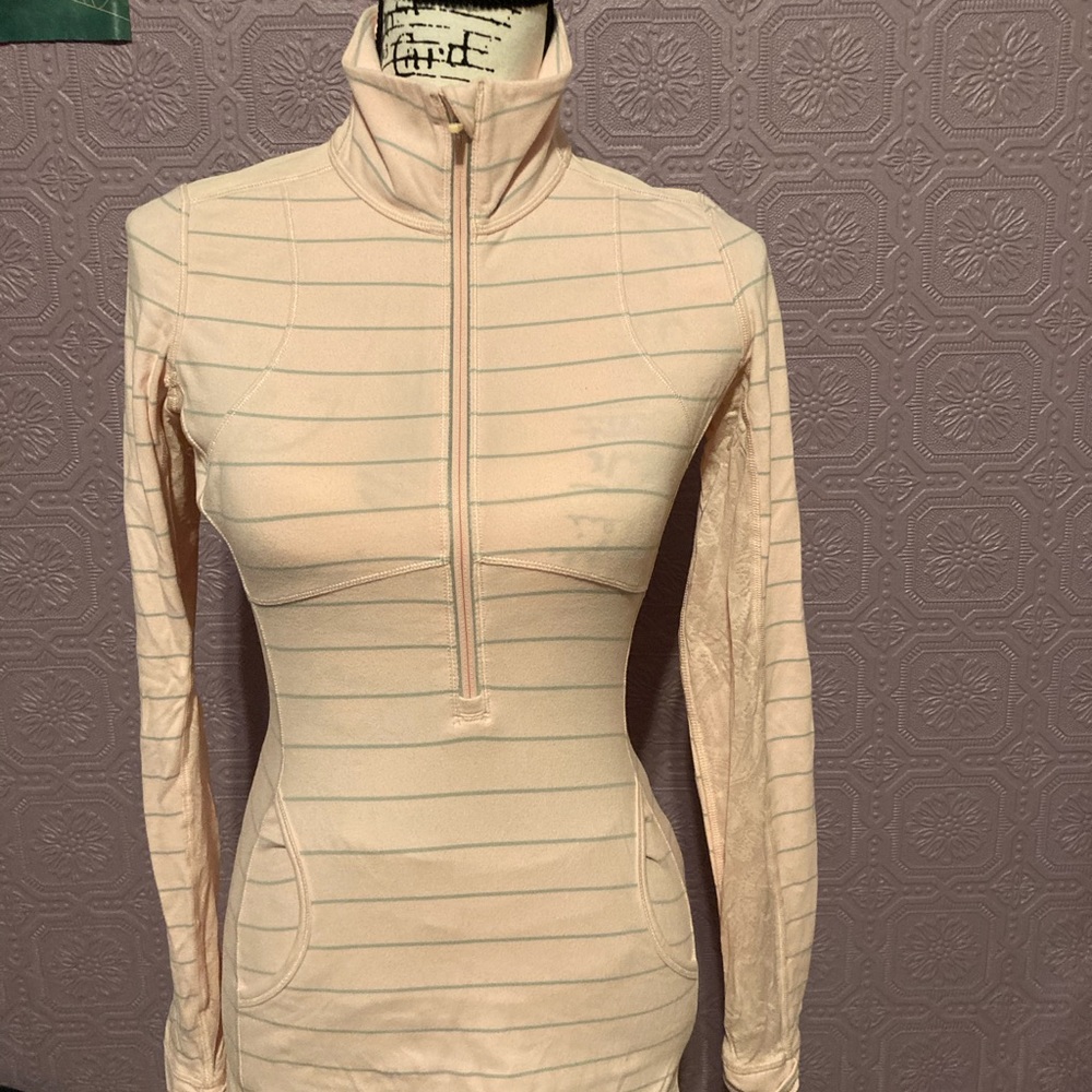 Lululemon 1/2 zip in soft pink / gray probably a 4